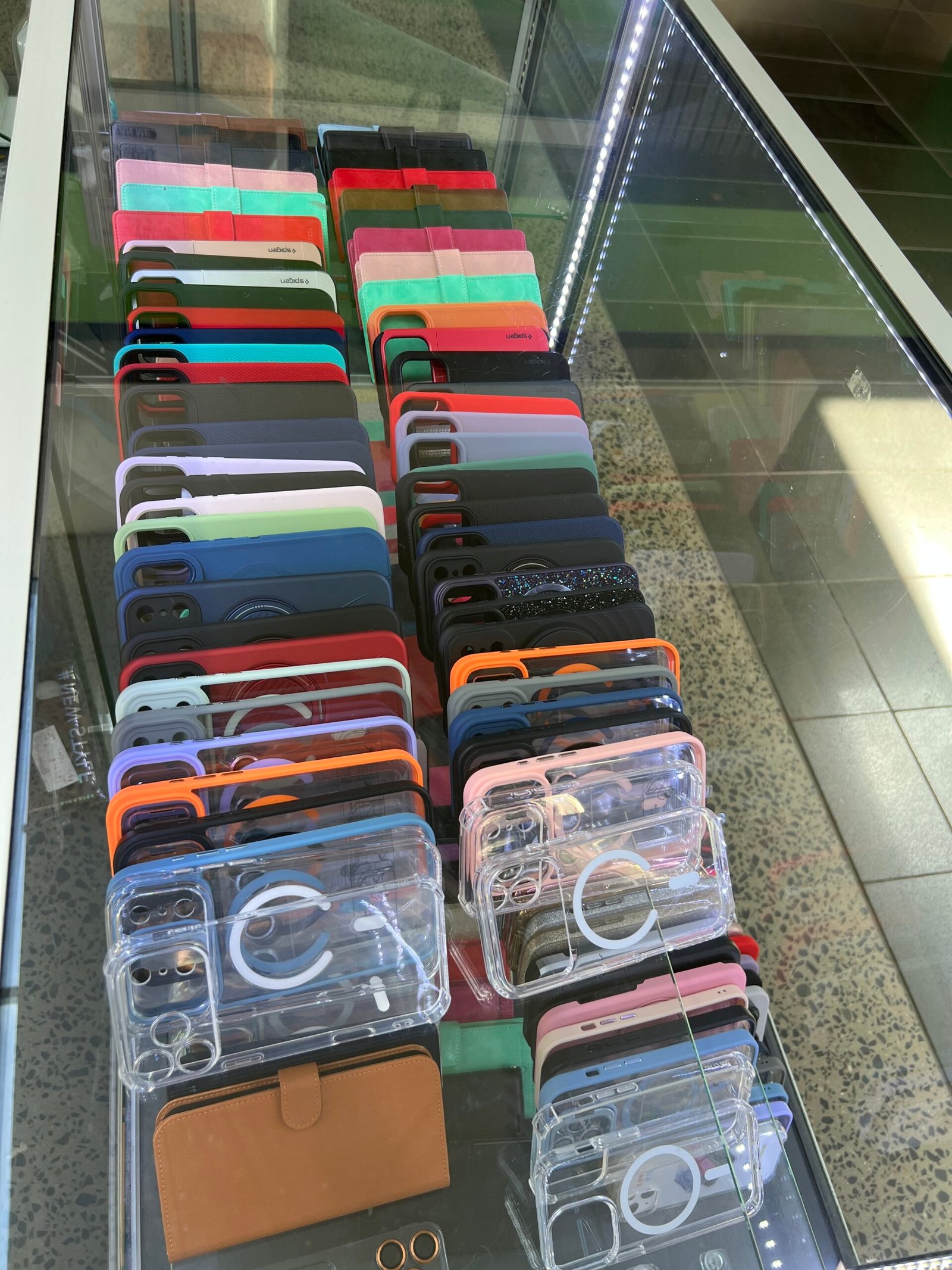 Phone cases on display at the Expressfixphone kiosk, Eden Rise Village, Berwick